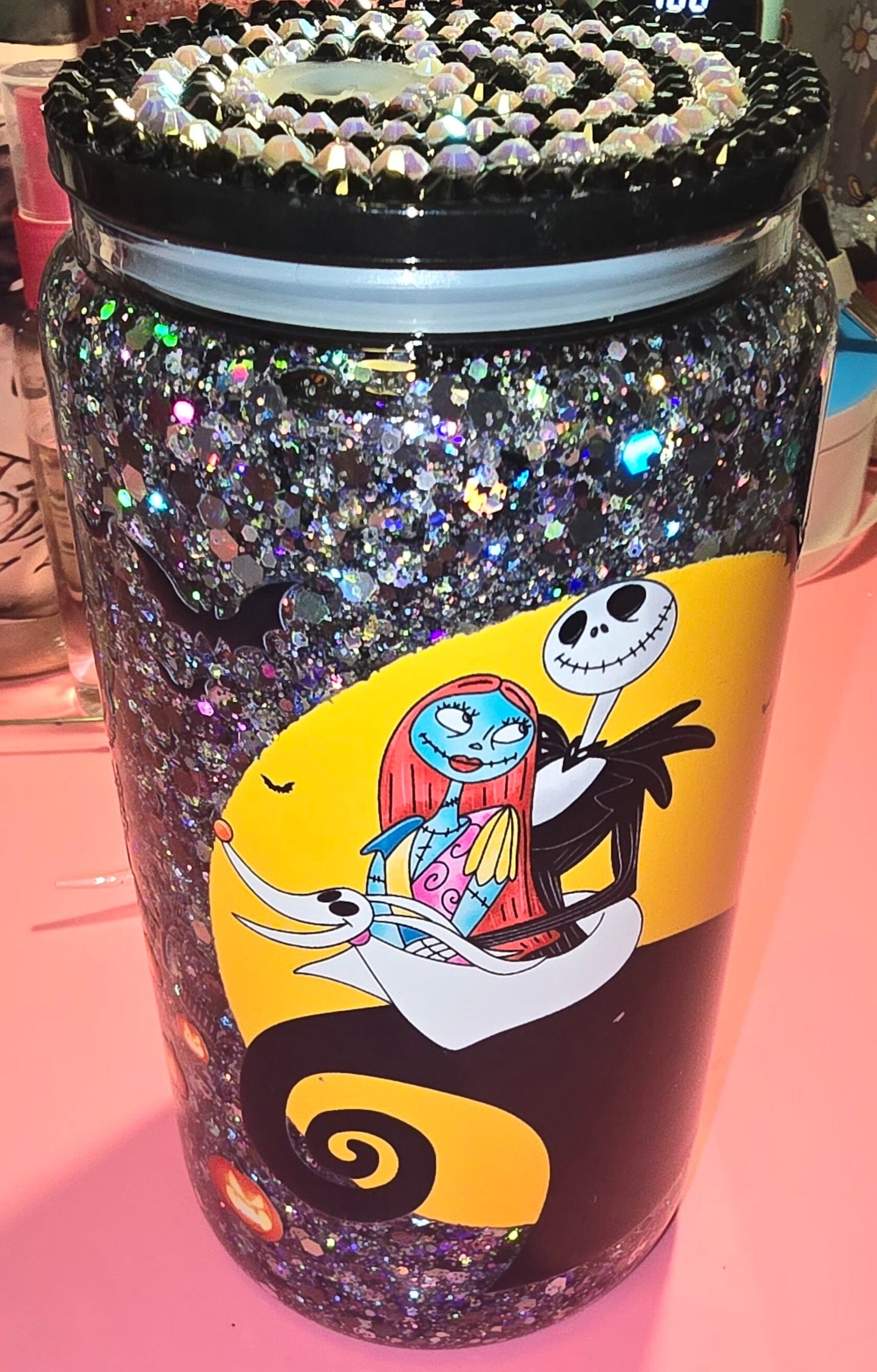 Nightmare glass tumbler cup with lid.