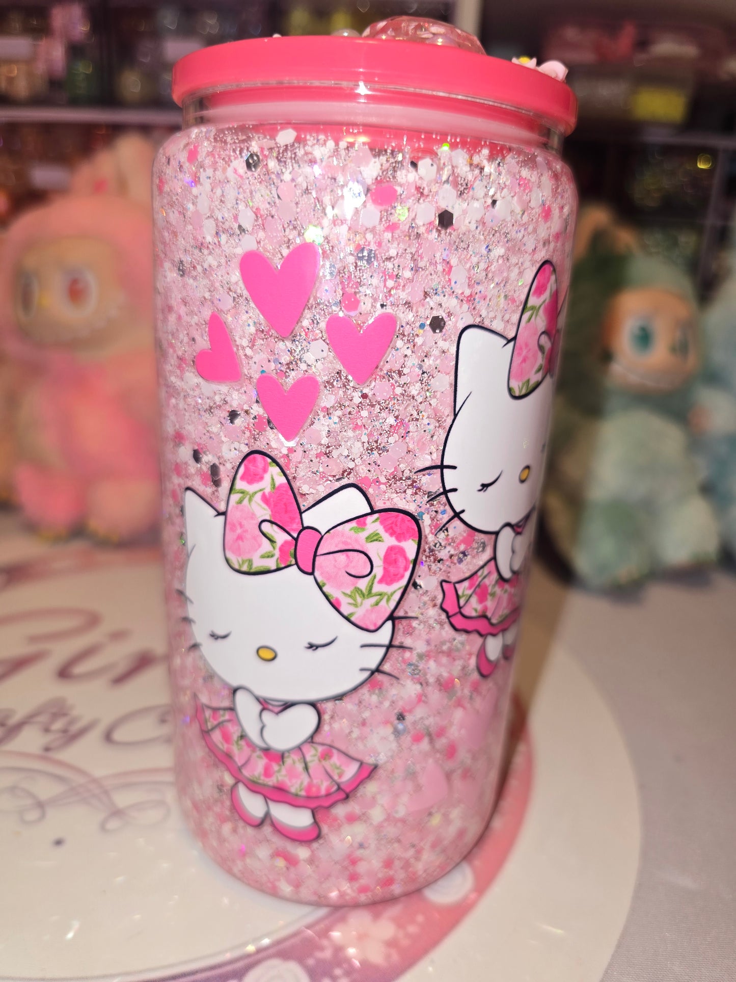 Cutesy pink HK glass snowglobe tumbler